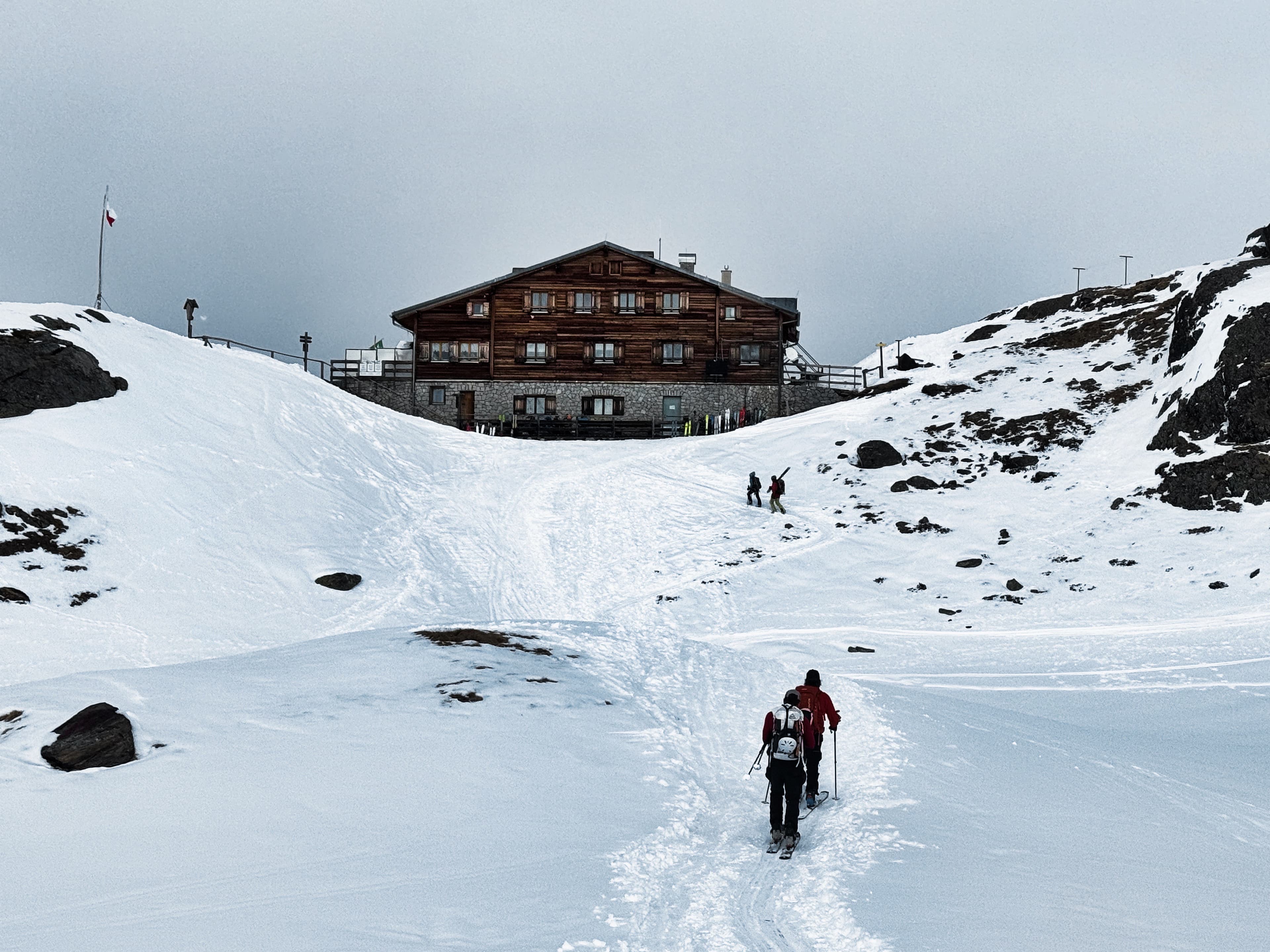 Approaching a mountain hut on a skinning track, overcast skies